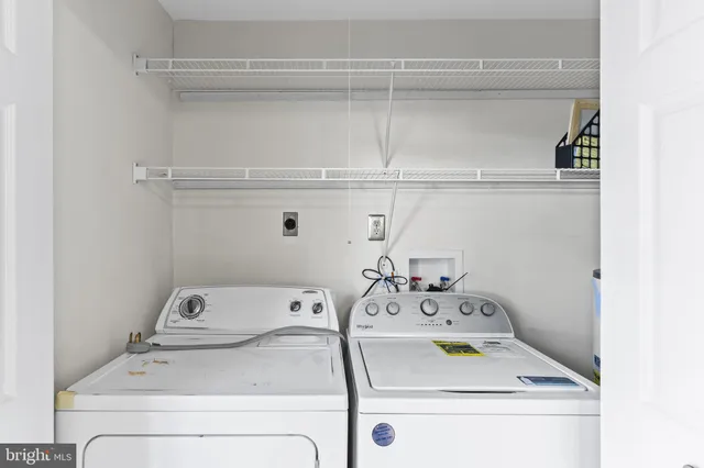 a utility room with a sink and a stove
