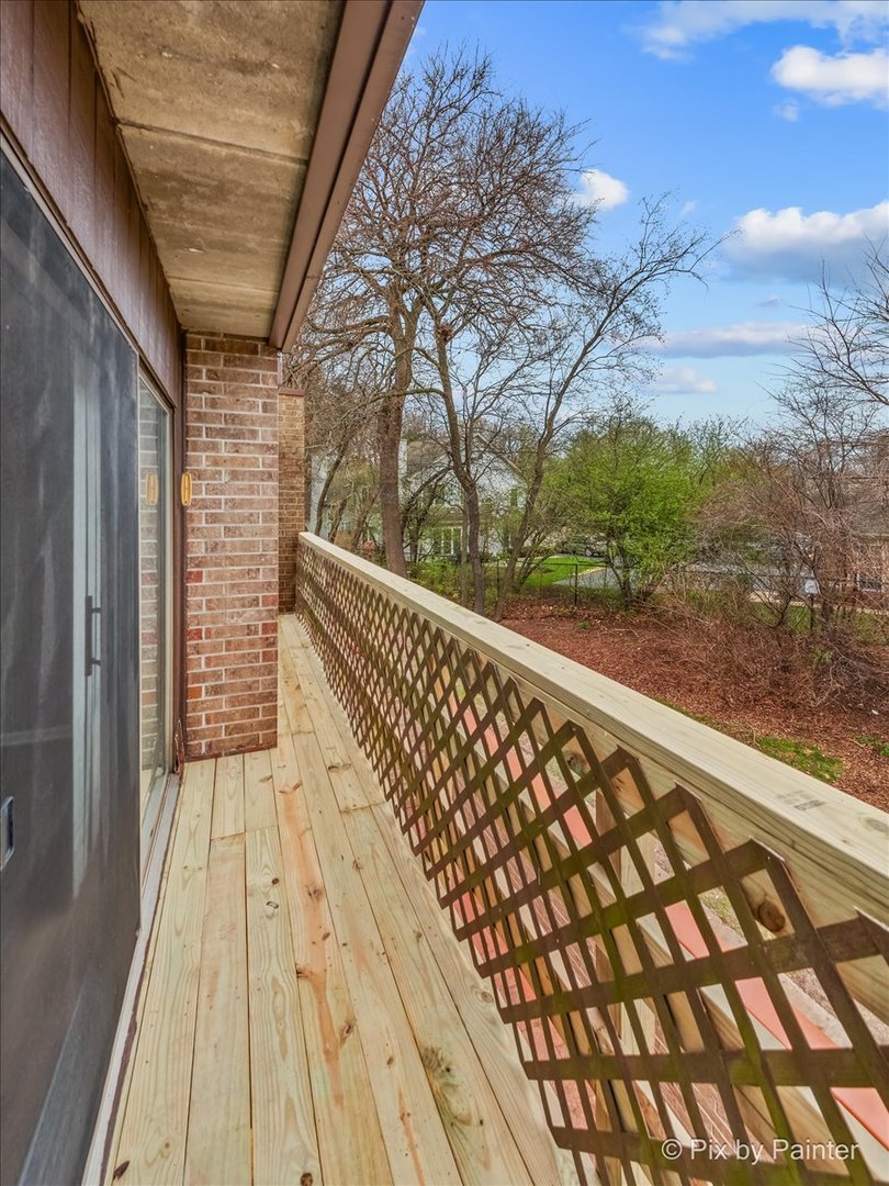 712 Kenneth Circle Elgin, IL 60120 - Photo 16 of 27 a view of balcony with wooden floor