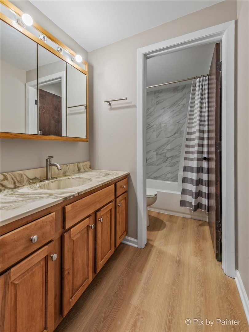 712 Kenneth Circle Elgin, IL 60120 - Photo 17 of 27 a spacious bathroom with a granite countertop sink mirror and a