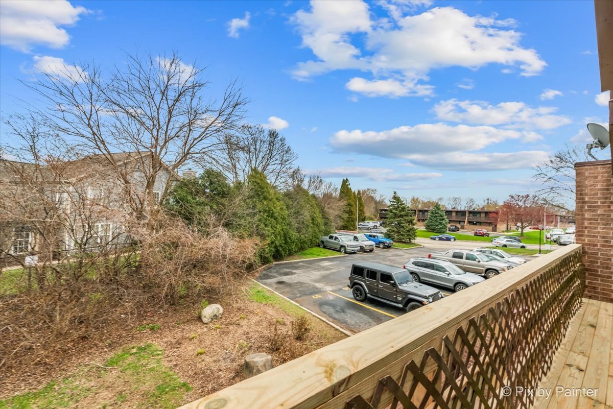 712 Kenneth Circle Elgin, IL 60120 - Photo 20 of 27 a view of a terrace with wooden floor and fence