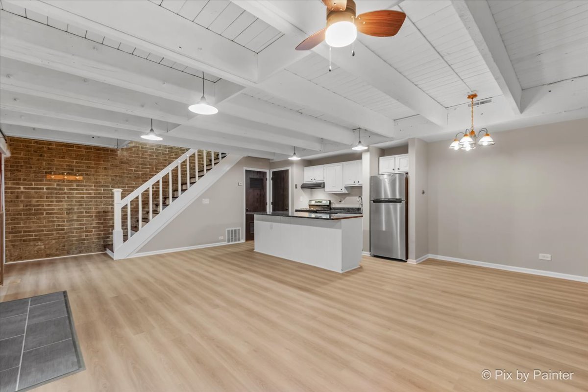 712 Kenneth Circle Elgin, IL 60120 - Photo 5 of 27 a view of a kitchen with cabinets and stainless steel appliances