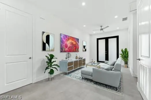 a living room with furniture potted plant and a flat screen tv