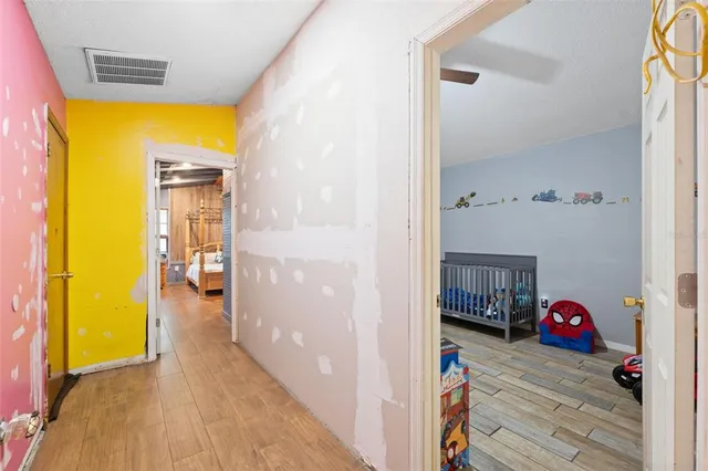 a view of a bedroom from a hallway