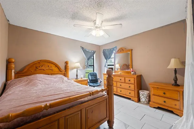 a bedroom with a bed and furniture