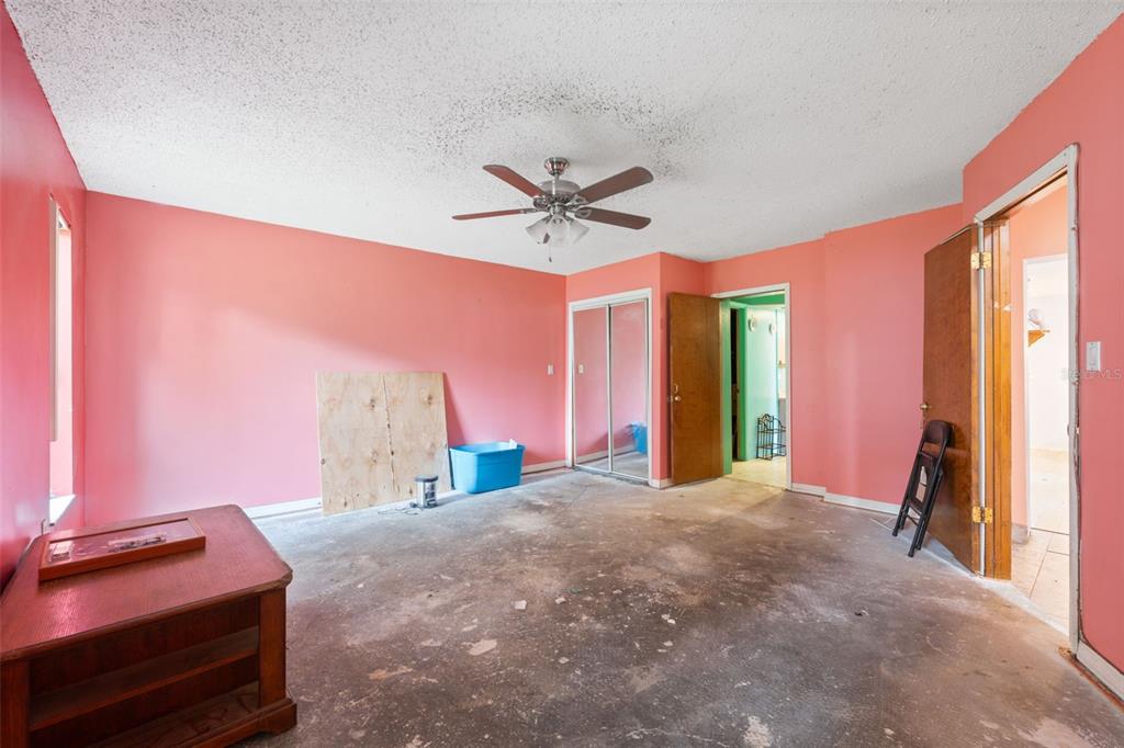 18160 Spangler Avenue Brooksville, FL 34604 - Photo 24 of 37 a bed room with a bed and a television