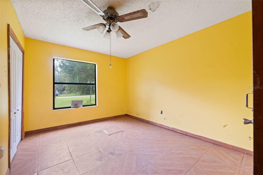 18160 Spangler Avenue Brooksville, FL 34604 - Photo 27 of 37 a view of an empty room with a window