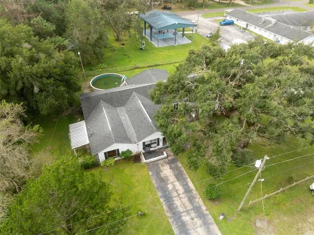 an aerial view of a house with a garden