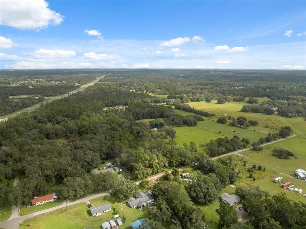 18160 Spangler Avenue Brooksville, FL 34604 - Photo 36 of 37 a view of a city with mountains in the background