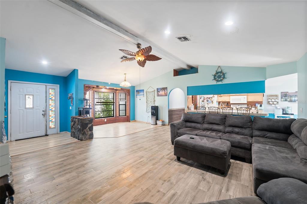 18160 Spangler Avenue Brooksville, FL 34604 - Photo 6 of 37 a living room with furniture and wooden floor