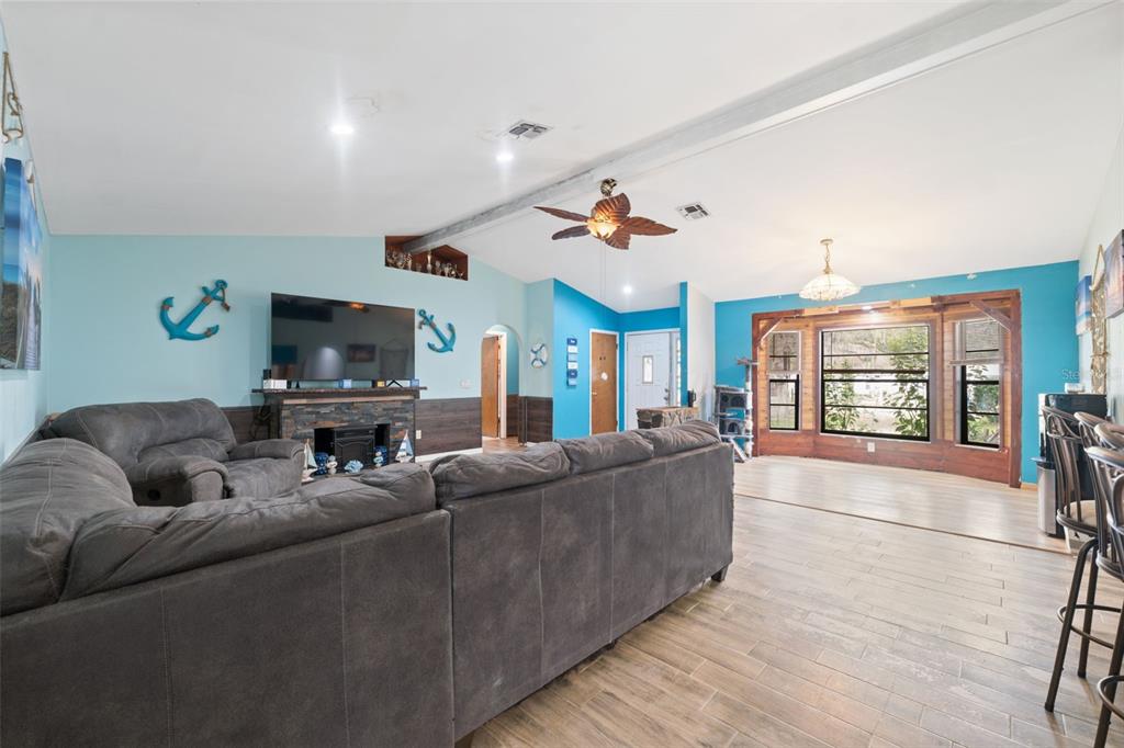 18160 Spangler Avenue Brooksville, FL 34604 - Photo 7 of 37 a living room with furniture and a flat screen tv