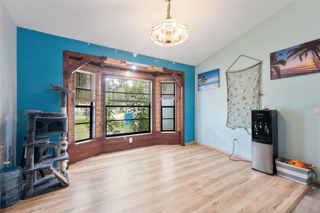 18160 Spangler Avenue Brooksville, FL 34604 - Photo 10 of 37 a bed room with a bed and a television