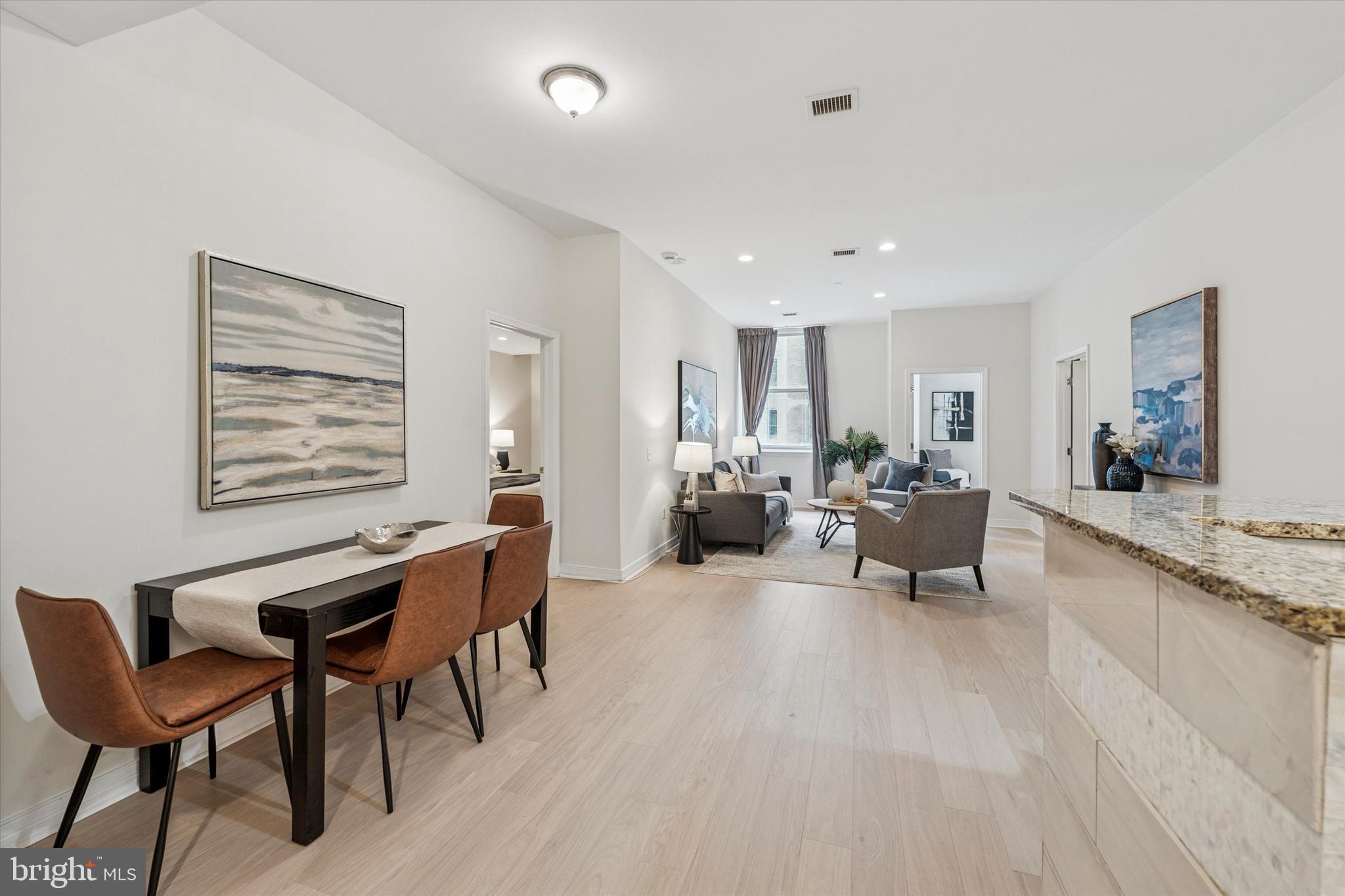 1600 Arch Street, Unit 1706 Philadelphia, PA 19103 - Photo 11 of 34 a living room with furniture and a large window