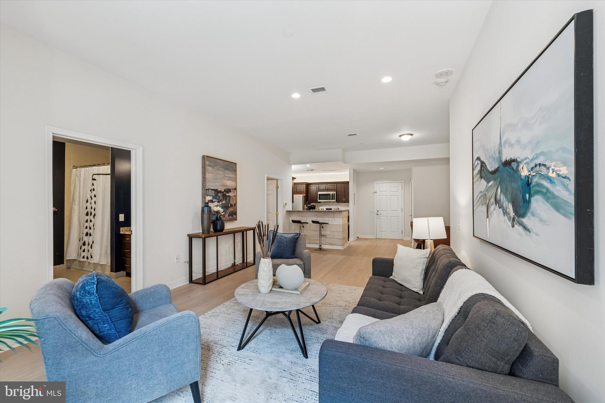1600 Arch Street, Unit 1706 Philadelphia, PA 19103 - Photo 13 of 34 a living room with furniture and a large window
