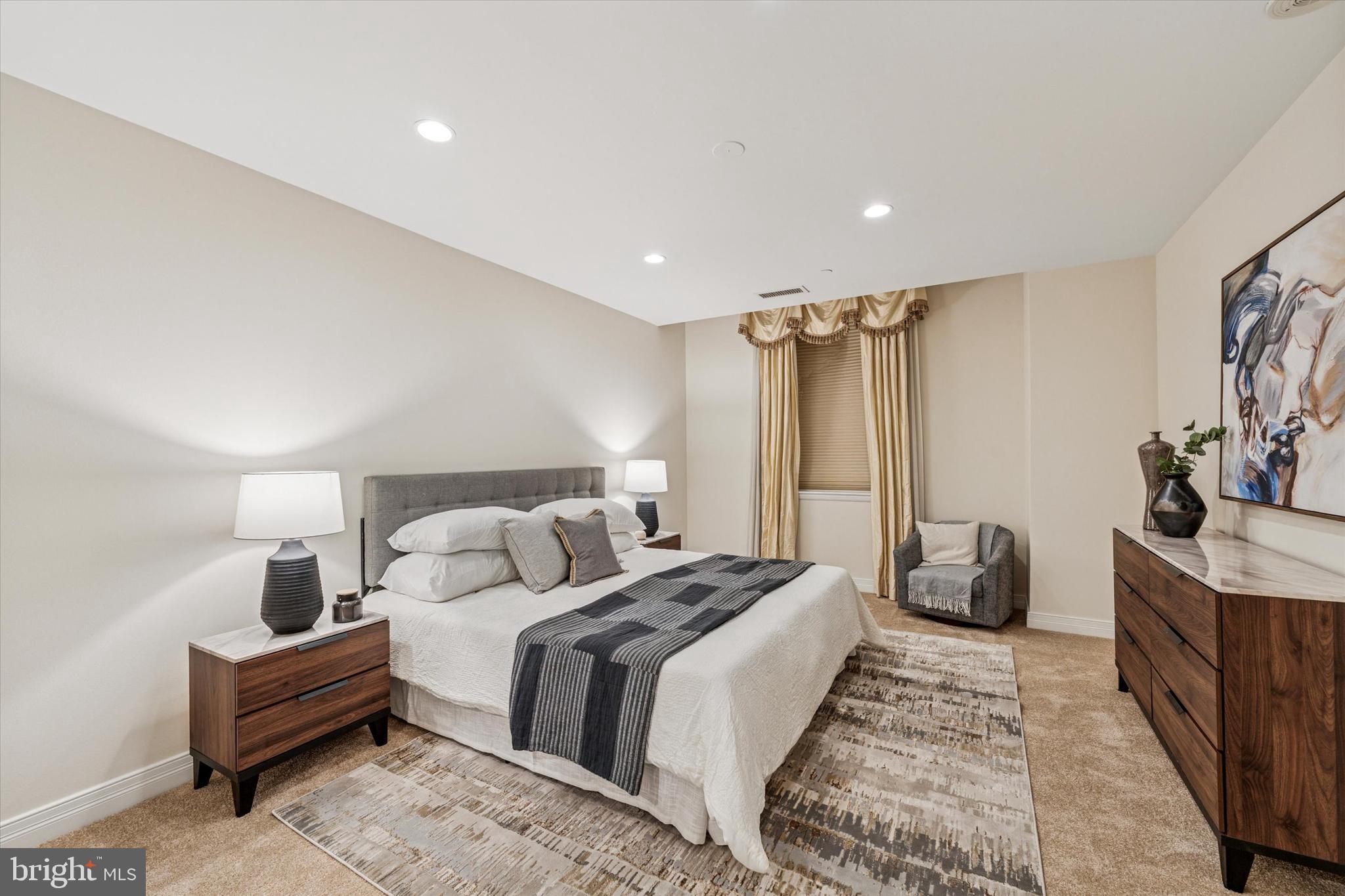 1600 Arch Street, Unit 1706 Philadelphia, PA 19103 - Photo 14 of 34 a bedroom with a bed and a walk in closet