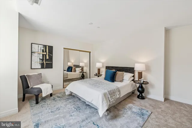 a bedroom with a bed and lamp