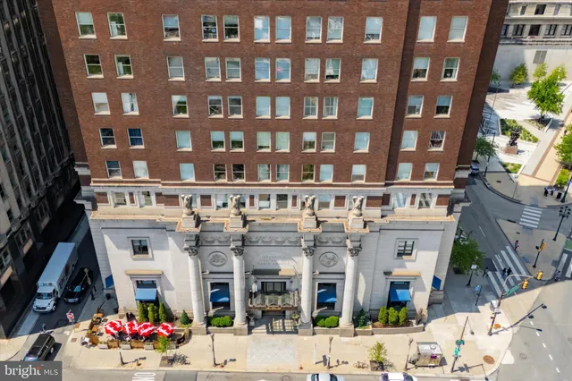 a front view of a building with lots of windows