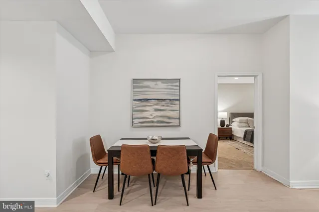 a view of a dining room with furniture and window