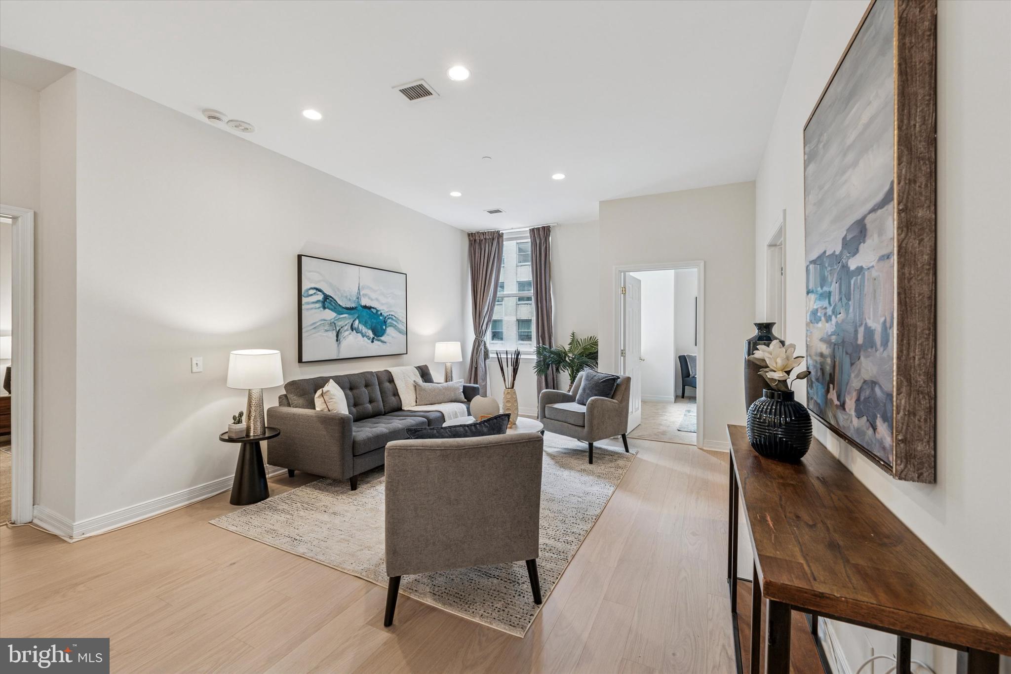 1600 Arch Street, Unit 1706 Philadelphia, PA 19103 - Photo 10 of 34 a living room with furniture or couch and a wooden floor