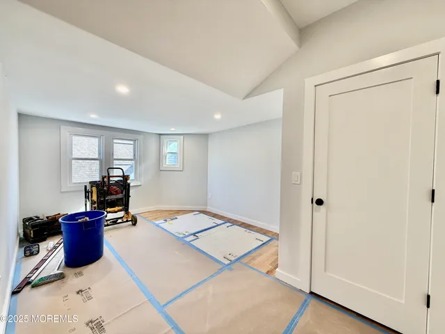 a kitchen with granite countertop a sink a counter space and cabinets