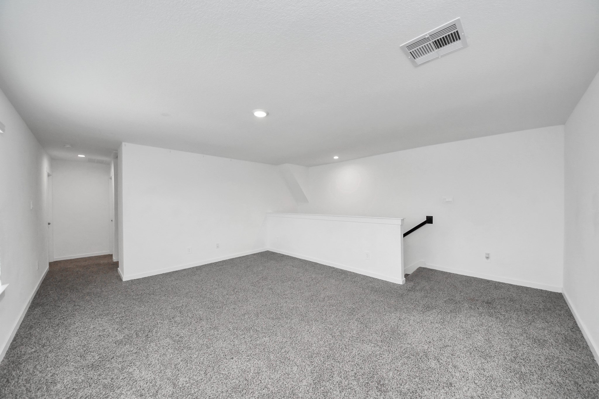 31738 Melkridge Road Fulshear, TX 77441 - Photo 23 of 33 Upstairs you will discover the Wonderful Game Room with Wall of Windows giving lots of natural light inside, Lush Carpeting, Ceiling Fan and down the hallway you will discover Two Secondary Bedrooms and One Full Bathroom!