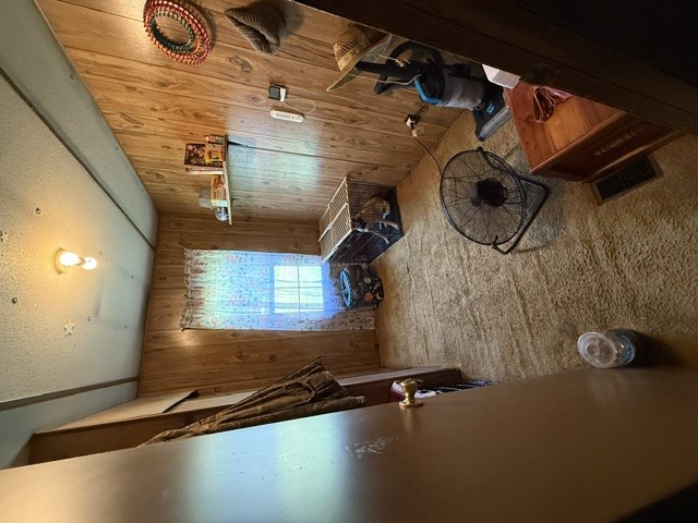 731 Glenn Ferry Road Fair Play, SC 29643 - Photo 5 of 23 Natural wood paneling adorns the walls and ceiling of this rustic interior space.