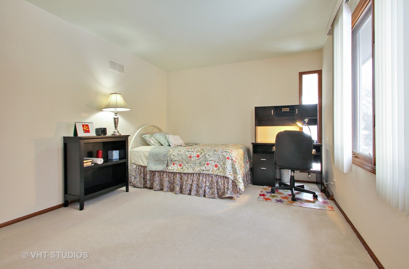 2740 Landwehr Road Northbrook, IL 60062 - Photo 12 of 15 a bedroom with a bed and a chandelier