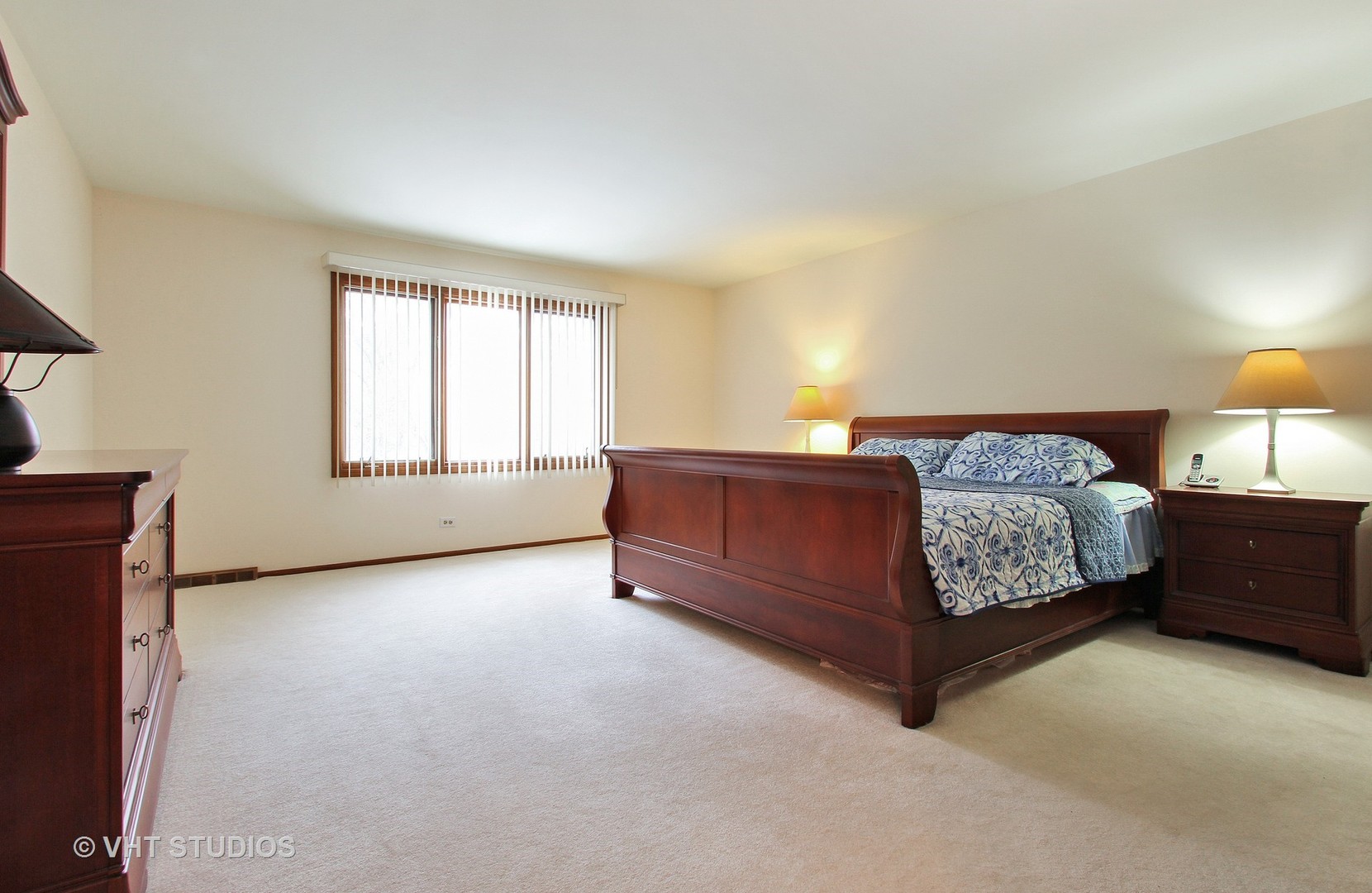 2740 Landwehr Road Northbrook, IL 60062 - Photo 10 of 15 a bedroom with a bed and window