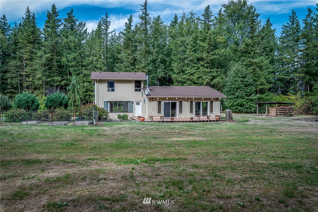 7586 Goodwin Road Everson, WA 98247 - Photo 1 of 22 a front view of a house with a garden