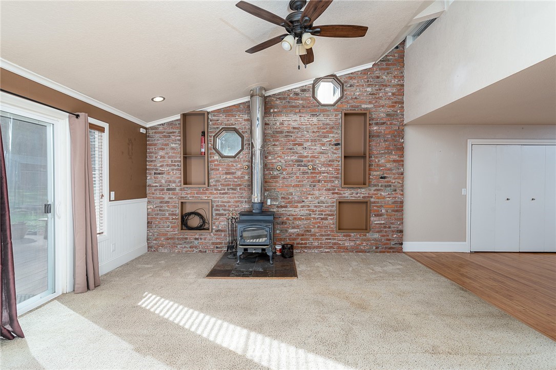 7586 Goodwin Road Everson, WA 98247 - Photo 12 of 22 a view of a livingroom with furniture and a ceiling fan