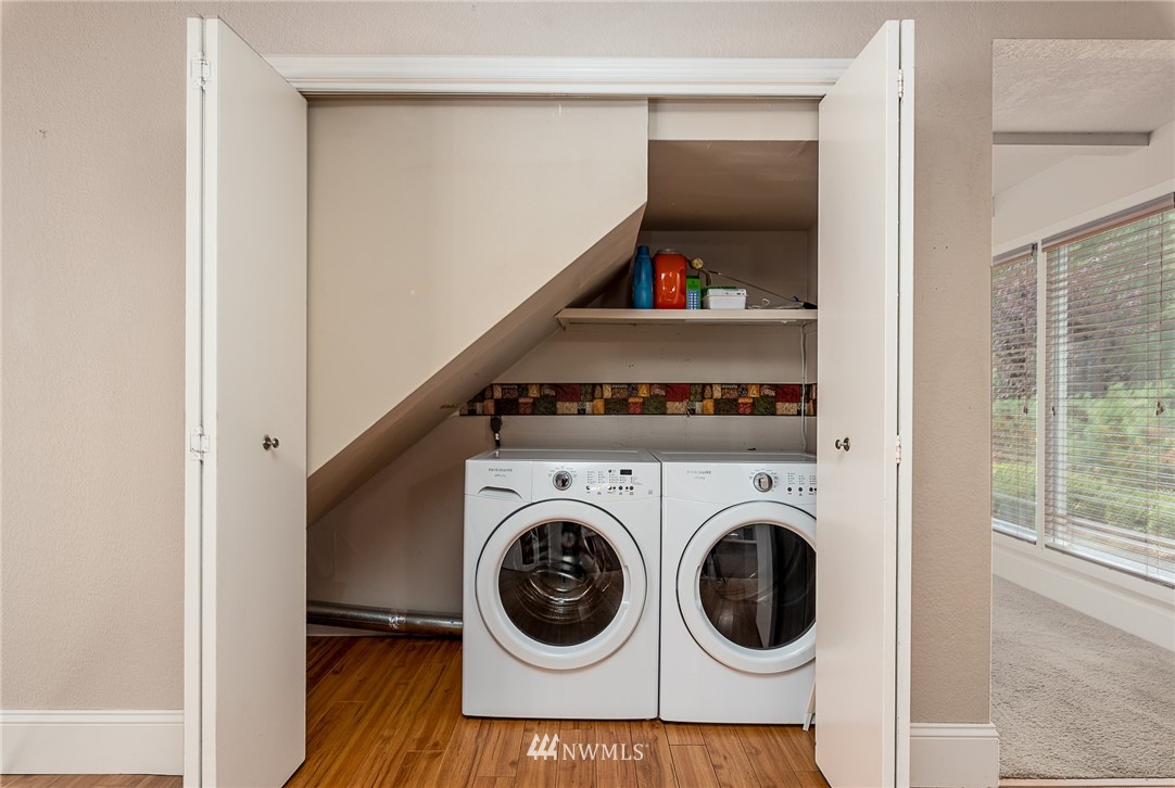 7586 Goodwin Road Everson, WA 98247 - Photo 15 of 22 a utility room with dryer washer and a view of bedroom