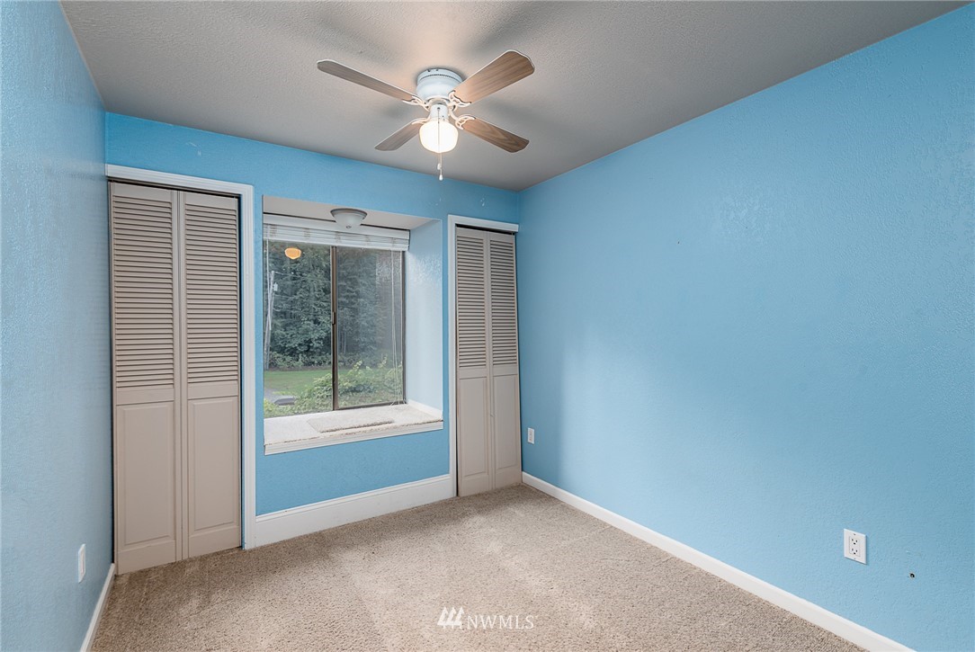 7586 Goodwin Road Everson, WA 98247 - Photo 6 of 22 an empty room with windows and fan