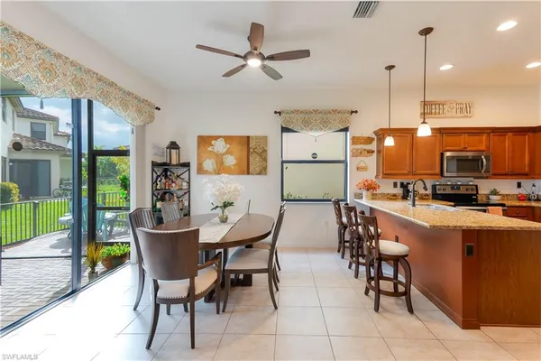 a view of a dining room with furniture window and outside view