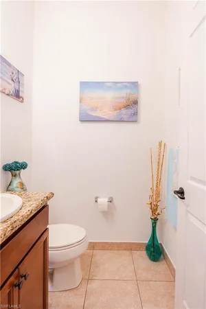 a bathroom with a toilet a sink and garden