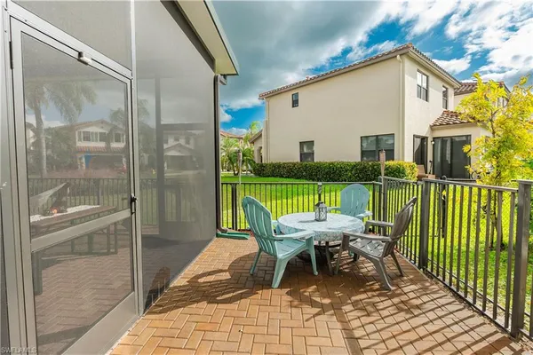 a view of a balcony with furniture