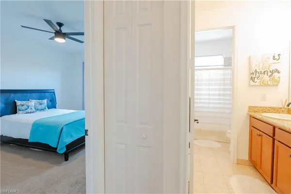 a bedroom with a bed and a cabinets