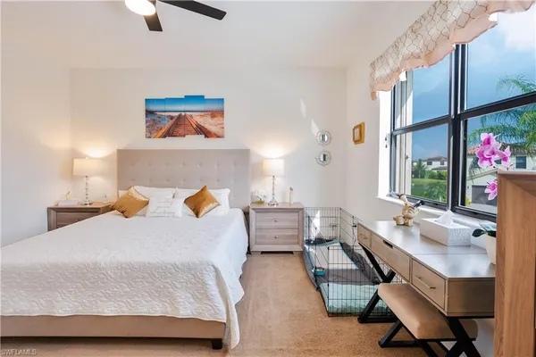 a bedroom with furniture and a potted plant