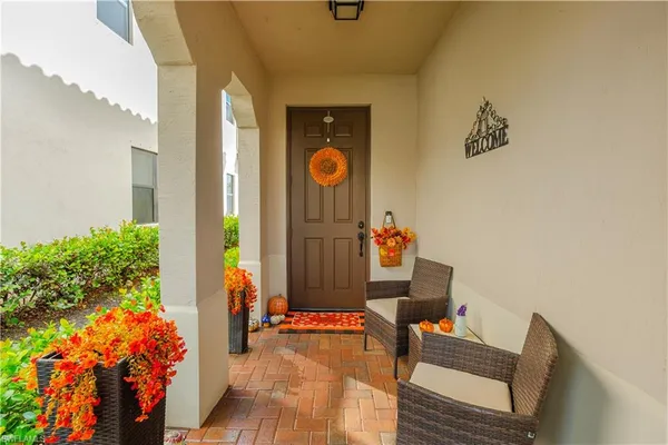 an outdoor living room with dining room and stairs