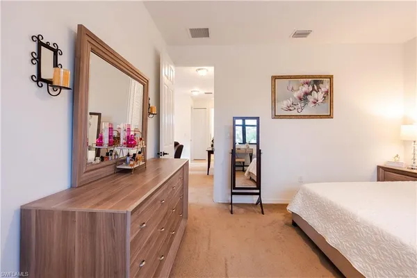 a bedroom with a bed and a view of bathroom