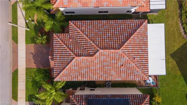 a view of a building with a wooden floor and a potted plant