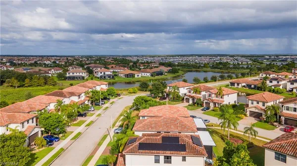 an aerial view of residential houses with outdoor space