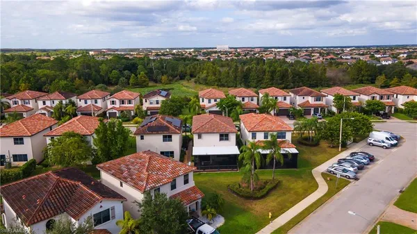 an aerial view of residential houses and outdoor space