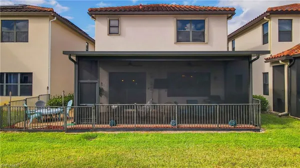 a house with swimming pool in front of it