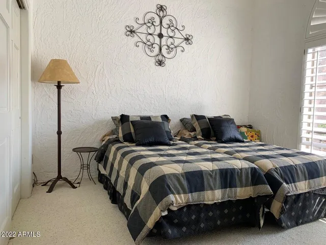 a room with furniture and a large window