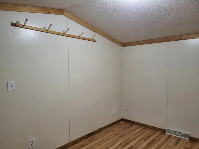 a view of a room with racks on the wall