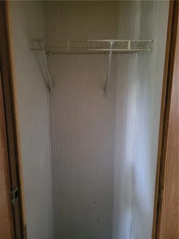 a view of an empty walk in closet