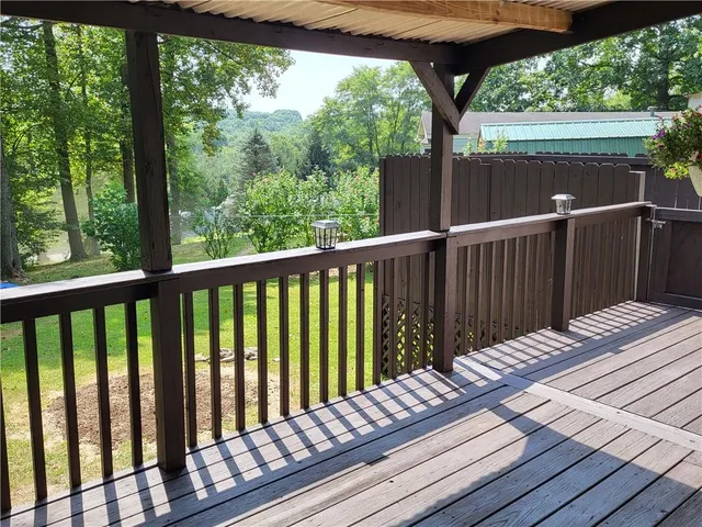 a view of balcony with wooden floor