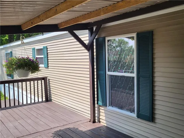 a view of backyard with wooden deck