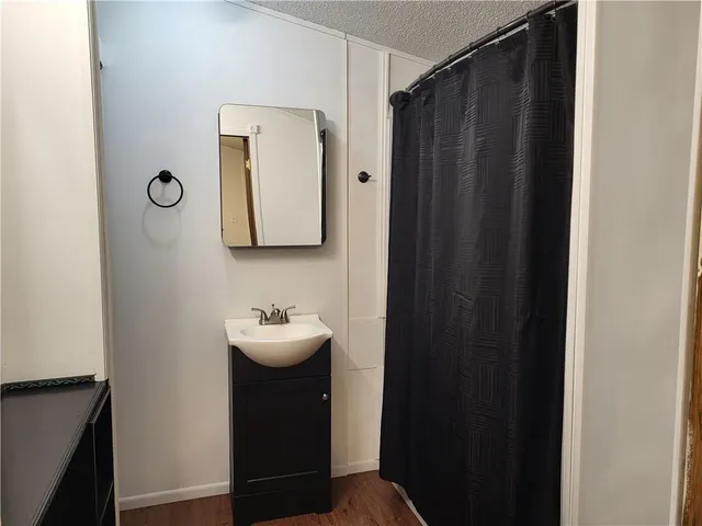 a bathroom with a sink and mirror