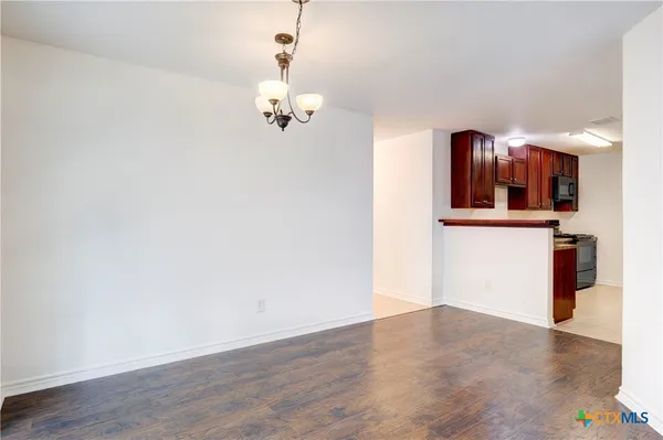a view of kitchen with wooden floor