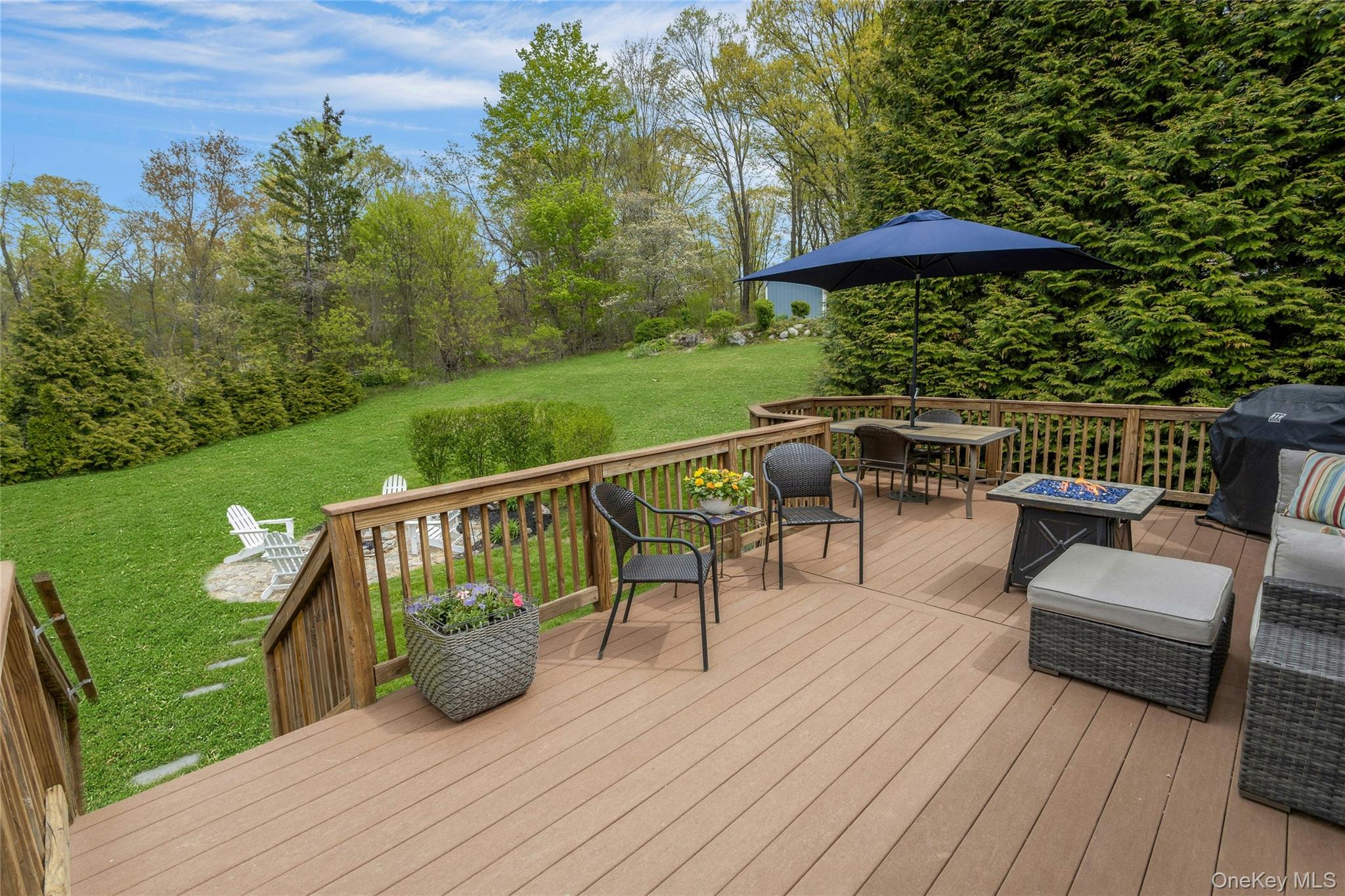 340 Osceola Road Jefferson Valley, NY 10535 - Photo 32 of 48 a view of a chairs and table on the wooden deck